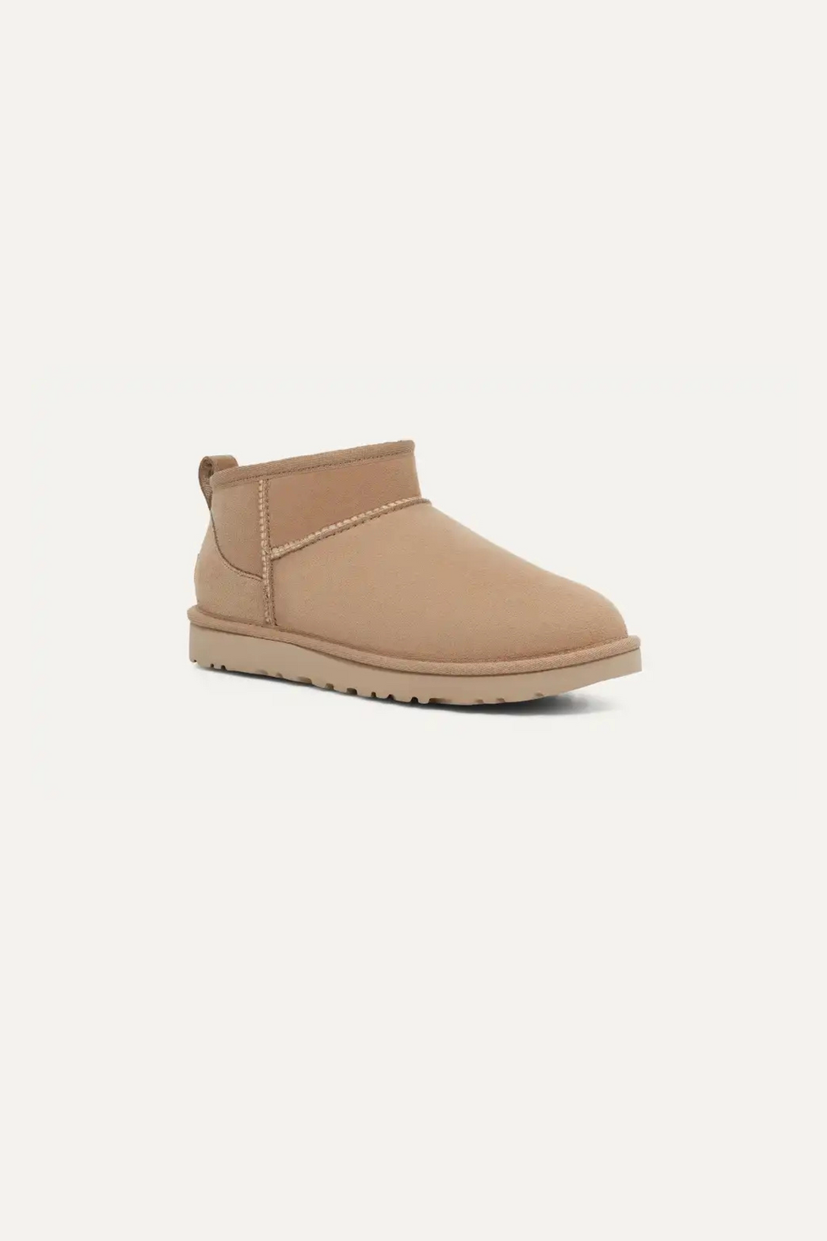 UGG women classic ultra mini in sand. Side view
